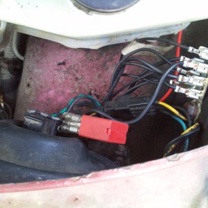 Nearside inner wing/headlight under bonnet