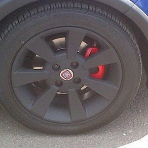 Front plasti dipped wheel and red caliper. 100hp